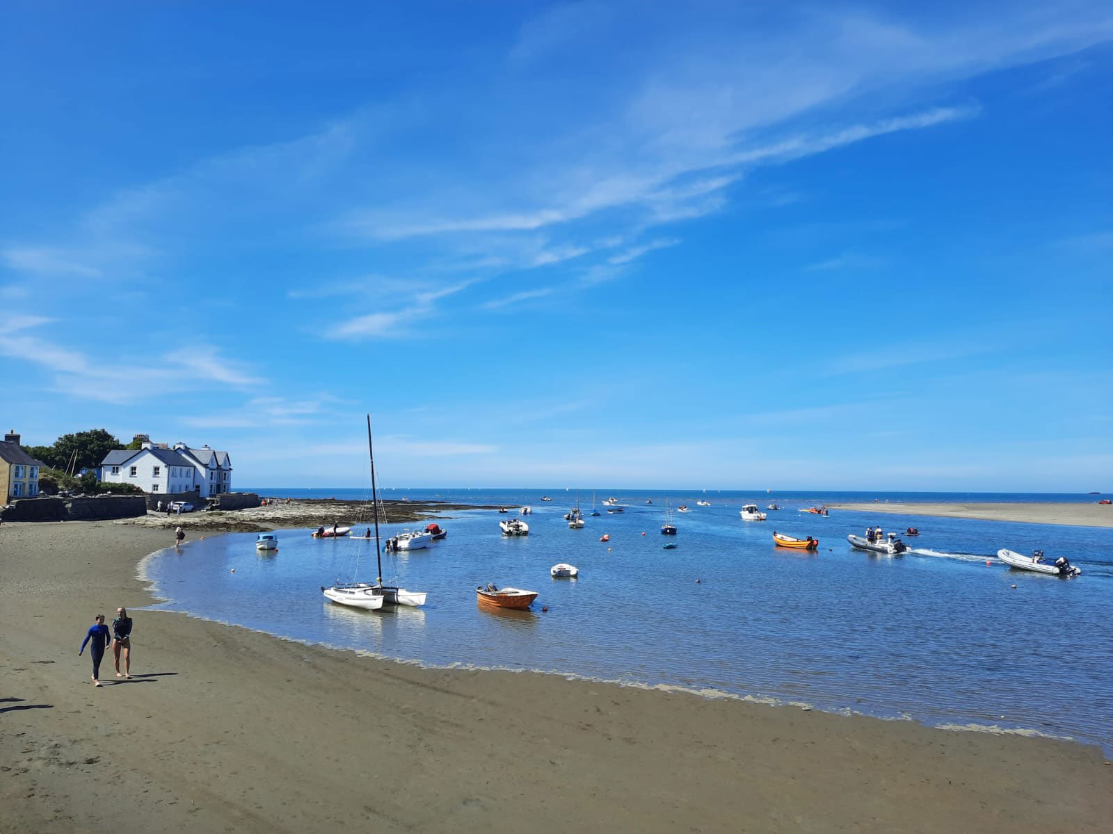 Mid tide with a handful of boats in the estuary