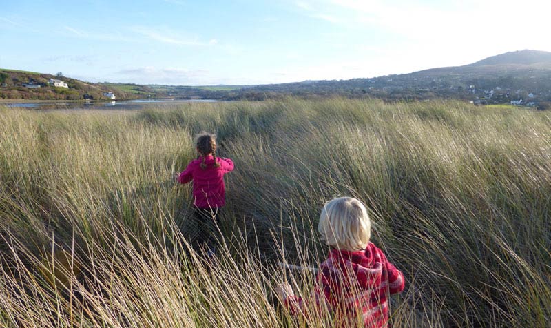 Fun in the sand dunes at Newport Sands