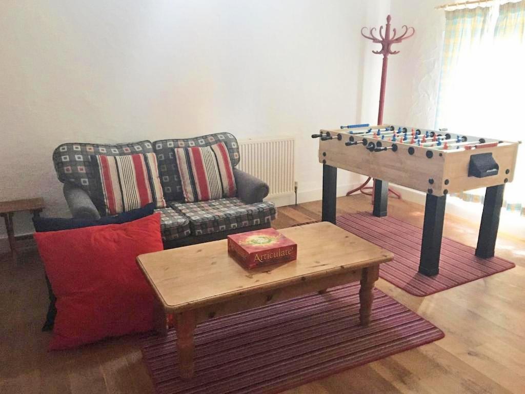 Separate area with tv and table football Separate area with tv and table football