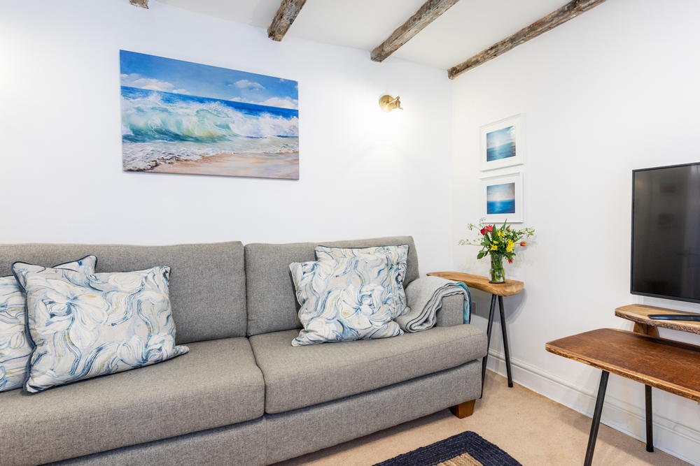 Living room with coastal paintings Living room with coastal paintings