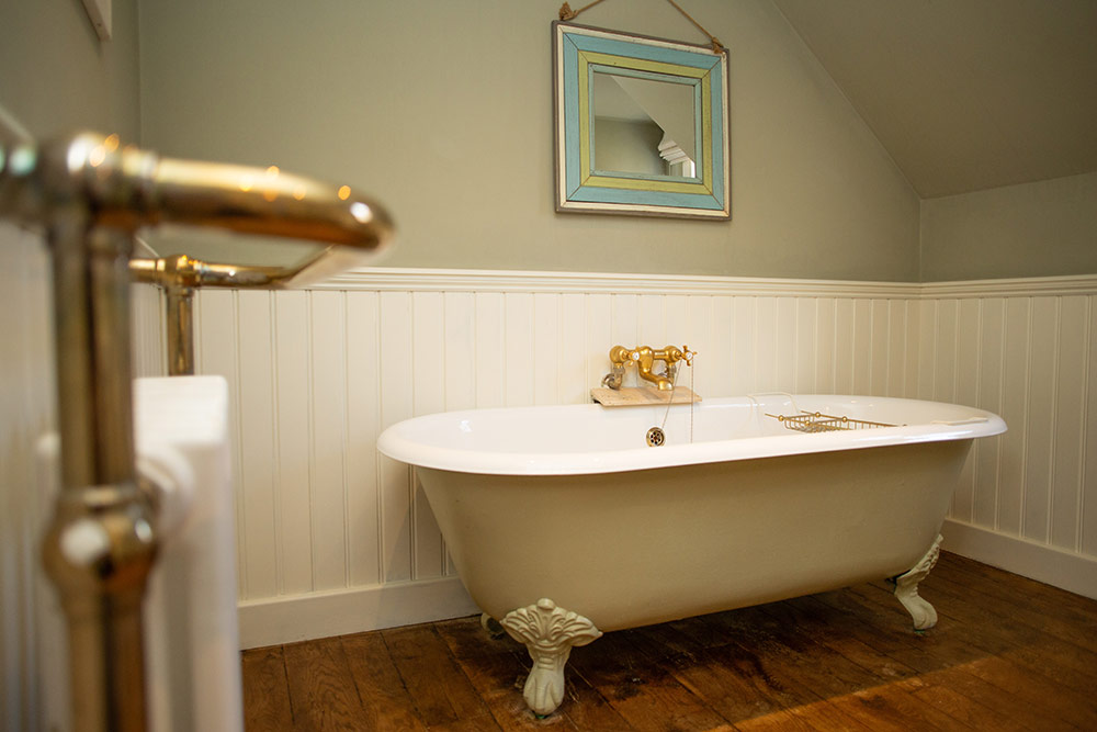 The family bathroom with roll top bath The family bathroom with roll top bath