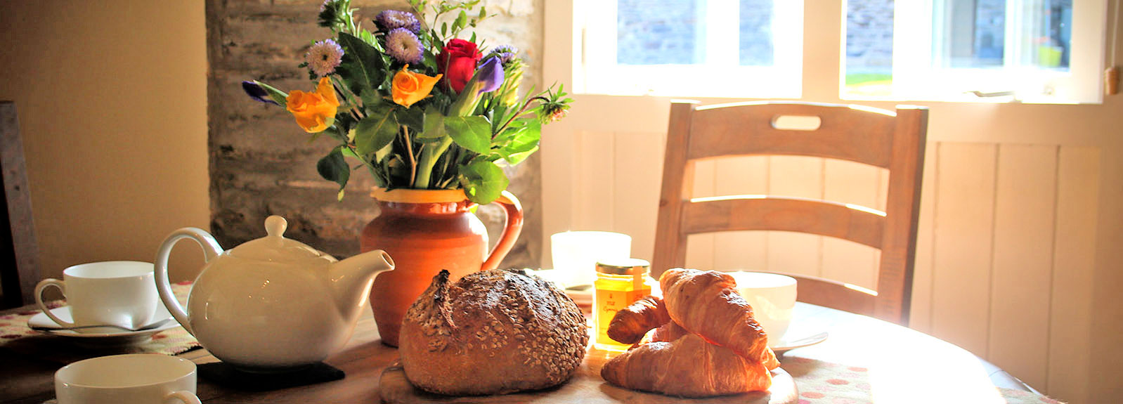 Continelntal breakfast on the dining table Continelntal breakfast on the dining table